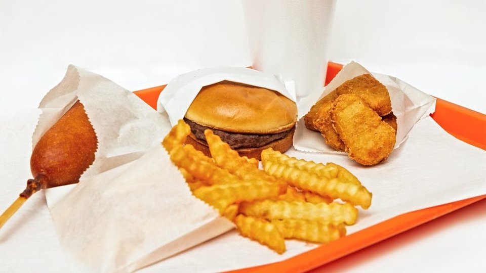 Fast food menu with burgers and chicken sandwiches.